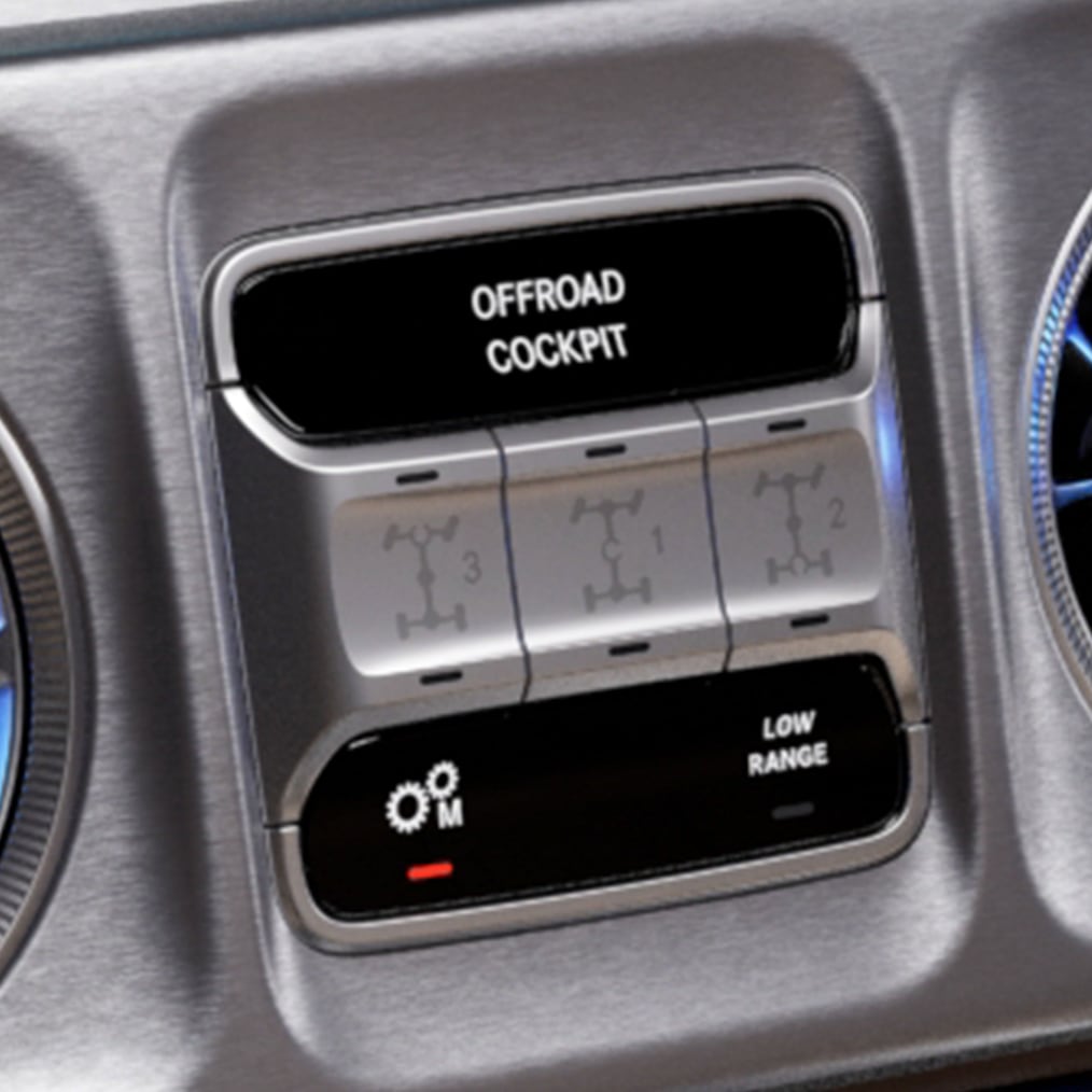 Gros plan sur le poste de conduite OFFROAD d'une Classe G avec les 3 contacteurs pour les blocages de différentiel.